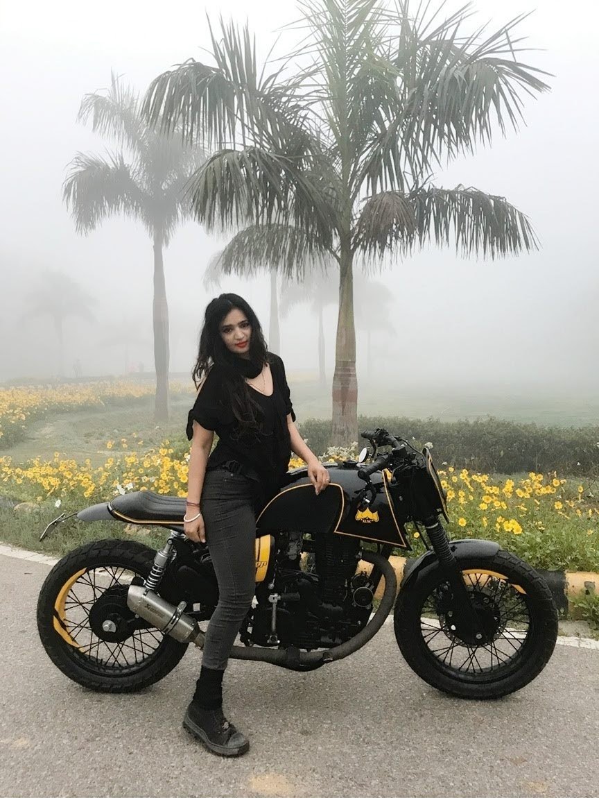 Divya Sandhu with a motorcycle