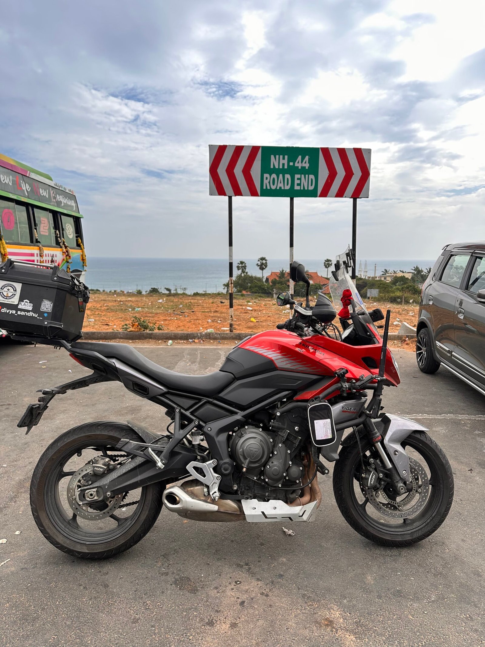 A motorcycle parked beside an open road